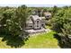 Aerial view showcasing the property, mature trees, and surrounding neighborhood of this home for sale at 1473 E 130Th Dr, Thornton, CO 80241