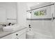 Bright bathroom featuring a granite countertop, tiled backsplash, and updated shower at 1473 E 130Th Dr, Thornton, CO 80241