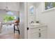 Bright bathroom featuring a granite countertop, undermount sink, and modern fixtures at 1473 E 130Th Dr, Thornton, CO 80241