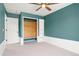 Bedroom features a vaulted closet, shelving, and wainscotting at 1473 E 130Th Dr, Thornton, CO 80241