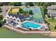 Aerial view showcasing a community pool, clubhouse, and recreational areas, including a playground and tennis courts at 1473 E 130Th Dr, Thornton, CO 80241