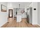 Modern kitchen with white cabinets, granite countertops and stainless steel appliances at 1473 E 130Th Dr, Thornton, CO 80241