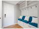 Mudroom features built-in bench with storage, shelving, and coat hooks at 1473 E 130Th Dr, Thornton, CO 80241