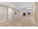 Spacious finished basement with a fireplace and egress windows for natural light at 11957 S Swift Fox Way, Parker, CO 80134