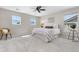 A well-lit bedroom includes a comfortable bed, chair, and tasteful decor at 11957 S Swift Fox Way, Parker, CO 80134
