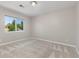 Bright bedroom offering ample natural light through a large window at 11957 S Swift Fox Way, Parker, CO 80134