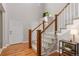 The foyer boasts hardwood floors, a carpeted staircase, and a modern decor at 11957 S Swift Fox Way, Parker, CO 80134