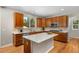 Bright kitchen featuring granite counters, stainless appliances, and a center island at 11957 S Swift Fox Way, Parker, CO 80134