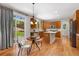 Well-lit kitchen adjacent to a breakfast nook and backyard views, with a central island at 11957 S Swift Fox Way, Parker, CO 80134