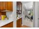 The kitchen area features wood cabinets, granite countertops, and seamless access to the dining area at 11957 S Swift Fox Way, Parker, CO 80134