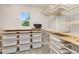 Well-organized walk-in closet with custom shelving and storage baskets at 11957 S Swift Fox Way, Parker, CO 80134