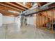 Unfinished basement with exposed ceiling, concrete flooring, and framing at 1248 Button Rock Dr, Longmont, CO 80504