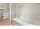 A luxurious soaking tub and glass enclosed shower stall in a bright bathroom at 1248 Button Rock Dr, Longmont, CO 80504