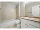 Bathroom with shower-tub combo, vanity and neutral finishes at 1248 Button Rock Dr, Longmont, CO 80504