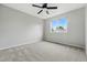 Bright bedroom featuring carpet flooring and a window with natural light at 1248 Button Rock Dr, Longmont, CO 80504
