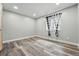 Bedroom featuring wood-look flooring and lots of natural light at 1248 Button Rock Dr, Longmont, CO 80504