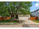 Charming home with a lush front yard and a spacious two-car garage at 1248 Button Rock Dr, Longmont, CO 80504