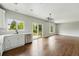 Modern kitchen with stainless steel dishwasher, white cabinets, and an open-concept design at 1248 Button Rock Dr, Longmont, CO 80504