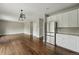 Well-lit kitchen flows into the living area, complete with stainless steel appliances and ample storage at 1248 Button Rock Dr, Longmont, CO 80504
