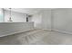 A cozy, neutral loft space with gray carpet and contemporary lighting at 1248 Button Rock Dr, Longmont, CO 80504