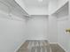 Walk-in closet with neutral walls and carpeting at 1248 Button Rock Dr, Longmont, CO 80504