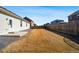 A large backyard with a wooden fence offering privacy at 56582 E 23Rd Ave, Strasburg, CO 80136