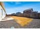 Spacious backyard offers a blank canvas with a patio, gravel accents, and potential for landscaping at 56582 E 23Rd Ave, Strasburg, CO 80136