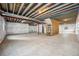 Spacious unfinished basement, ideal for creating a personalized living space or recreation area at 56582 E 23Rd Ave, Strasburg, CO 80136