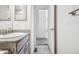 Bathroom vanity features a granite countertop, updated fixtures, and ample storage at 56582 E 23Rd Ave, Strasburg, CO 80136