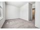 Carpeted bedroom with neutral walls and natural light at 56582 E 23Rd Ave, Strasburg, CO 80136