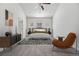 Cozy bedroom with a comfortable bed, neutral decor, and natural light creating a serene retreat at 56582 E 23Rd Ave, Strasburg, CO 80136