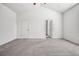 Bright bedroom with vaulted ceiling, carpet flooring, and white trim throughout at 56582 E 23Rd Ave, Strasburg, CO 80136