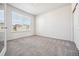 Comfortable bedroom with neutral carpet, a large window, and minimalist design at 56582 E 23Rd Ave, Strasburg, CO 80136