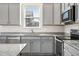 Stylish kitchen with modern appliances, granite countertops, and ample cabinet space providing great functionality at 56582 E 23Rd Ave, Strasburg, CO 80136