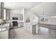 Beautiful kitchen with an island, stainless steel appliances, and tile flooring perfect for cooking and entertaining at 56582 E 23Rd Ave, Strasburg, CO 80136