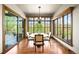 Bright dining room with scenic views and sliding glass doors at 9650 S Cougar Rd, Littleton, CO 80127