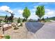 Entrance to gated property with deer statue and mountain views in background at 9650 S Cougar Rd, Littleton, CO 80127