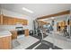 Versatile exercise room with kitchenette and fitness equipment, ideal for maintaining an active lifestyle at 9650 S Cougar Rd, Littleton, CO 80127