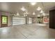 A spacious multi-car garage with ample room for storage and projects at 9650 S Cougar Rd, Littleton, CO 80127