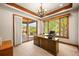 Bright home office with a large desk, private balcony and scenic views at 9650 S Cougar Rd, Littleton, CO 80127