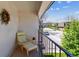 Outdoor Balcony with seating and privacy that overlooks a residential neighborhood street and landscape at 11402 W 17Th Pl, Lakewood, CO 80215
