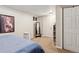 Cozy basement bedroom featuring neutral walls, carpet, and a full length mirror at 11402 W 17Th Pl, Lakewood, CO 80215
