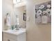 Chic bathroom with a modern vanity, stylish mirror, and elegant decor at 11402 W 17Th Pl, Lakewood, CO 80215