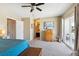 Spacious main bedroom featuring neutral paint colors, carpeted floors and access to the outdoor private deck at 11402 W 17Th Pl, Lakewood, CO 80215