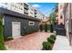 Stylish backyard with brick pavers, landscaped greenery, and a cozy, illuminated ambiance at 1730 N Gaylord St, Denver, CO 80206