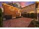 Inviting backyard with brick pavers and warm string lights for cozy outdoor gatherings at 1730 N Gaylord St, Denver, CO 80206