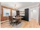 Dining room features exposed brick wall and hardwood floors at 1730 N Gaylord St, Denver, CO 80206