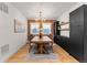 Dining room features brick accent wall, modern light fixture, and stylish decor at 1730 N Gaylord St, Denver, CO 80206