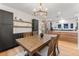 Open dining room features hardwood floors and kitchen at 1730 N Gaylord St, Denver, CO 80206