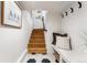 Welcoming entryway with wood stairs, stylish tile, and convenient coat storage at 1730 N Gaylord St, Denver, CO 80206